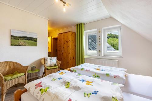 a bedroom with a bed and a window at Ferienhof Schade in Eslohe