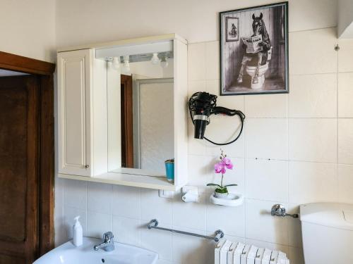 a bathroom with a sink and a mirror at Il Chiostro di Ribot in Lugnano in Teverina