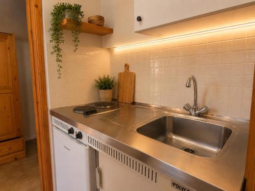 a kitchen with a sink and a counter top at Panorama Plataria Ionio Studios&Apartments in Plataria