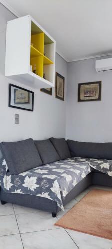 a bedroom with a bed and a yellow shelf at Big,Smart & Comfort ! in Kalamata
