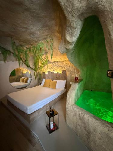 a bed in a room in a cave at EmmejSuite in Pozzuoli