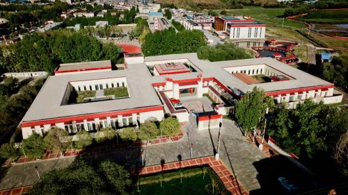 an overhead view of a large building with trees at Shigatse Summer Palace Healing Hotel in Shigatse