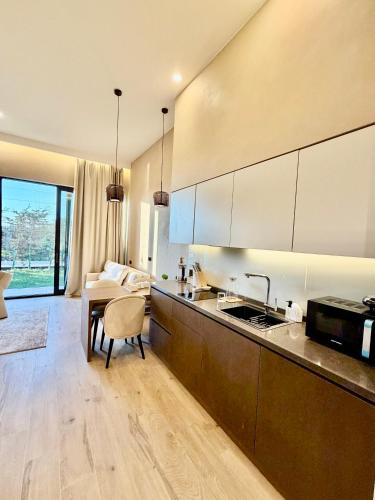 a kitchen with a sink and a counter top at Seabreeze Baku White Residence Studio, Terrace in Baku