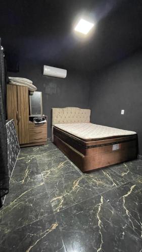 a bedroom with a bed and a tv in a room at Casa Vale do Sal 2 in Salinópolis