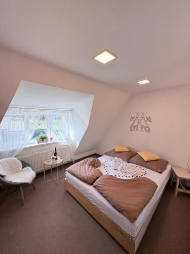 a bedroom with a large bed and a window at Kaštieľ Čičmany in Čičmany