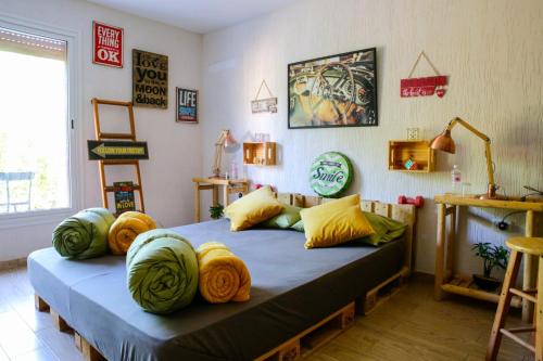 a bedroom with a bed with pillows on it at Casa Biba in Utique