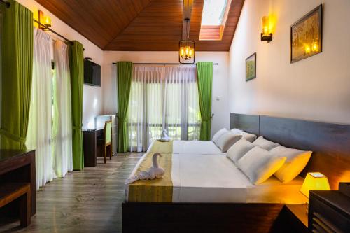 a bedroom with a large bed in a room at Villa D55 - A Private Villa with Character & Comfort in Kandy