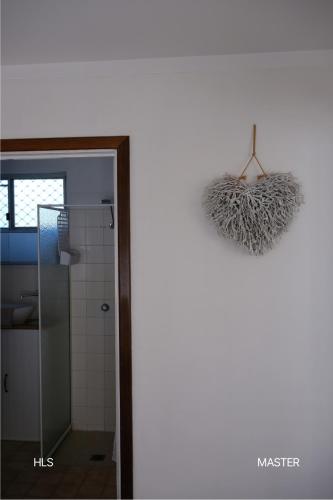 a bathroom with a glass shower and a mirror at Harbour Lane Stay in Geraldton