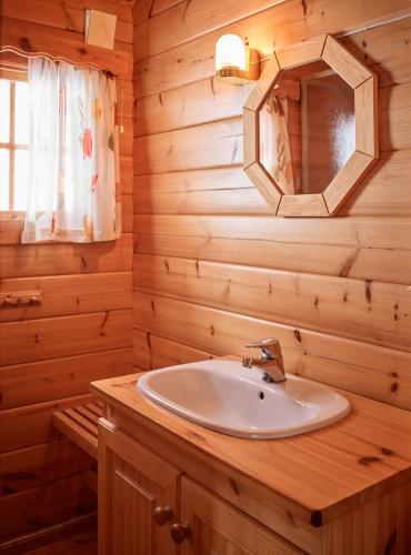 a bathroom with a sink and a mirror at Fjellro in Stranda