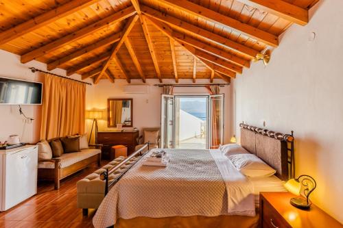 a bedroom with a large bed in a room at Filoxenia Hotel Monemvasia in Monemvasia