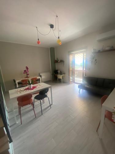 a living room with a table and two chairs at La terrazza nel borgo in Tortora