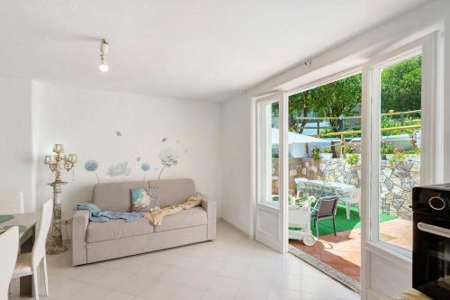 a living room with a couch and a table at Casa Gio & Angie in Forio d'Ischia