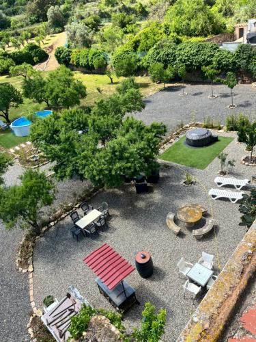 an aerial view of a park with a picnic table and chairs at Cal Nina in Espluga de Francolí