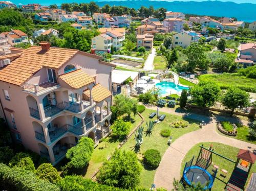 an aerial view of a house with a swimming pool at Lopar Family Residence 543a in Lopar
