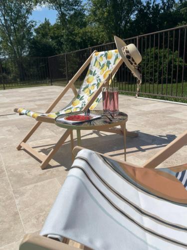 a rocking chair with a hat on top of it at Auberge Gardoise in Vallérargues