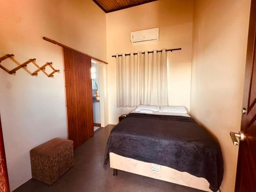 a bedroom with a large bed in a room at Casa do Bento - Lençóis Maranheses in Santo Amaro