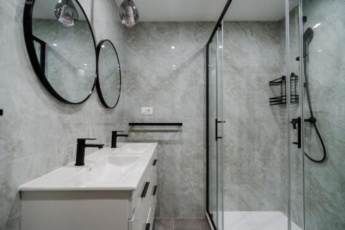 a bathroom with a sink and a shower at Matej's rooms in Korčula