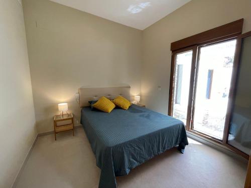 Llit o llits en una habitació de Ca Bebu