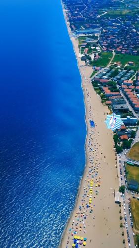 an aerial view of a beach with umbrellas and the ocean at NOVA PORT Boutique Hotel in Tekirdağ
