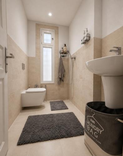 a bathroom with a sink and a toilet at Kefia house in Hammamet Nord