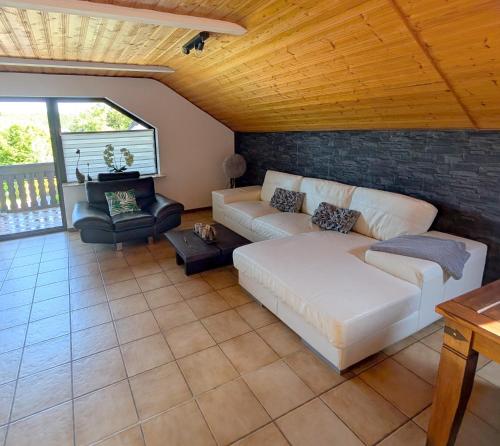 a living room with a couch and a table at FeWo bei Idar-Oberstein in Dickesbach