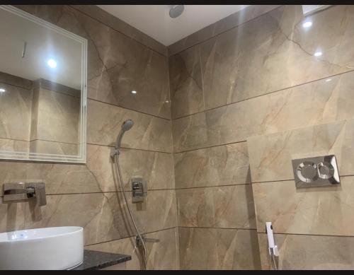 a bathroom with a shower and a sink at Family Group with Provide By PG Hotel Near New Delhi Railway station & Karol-Bagh in New Delhi