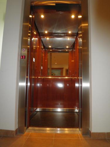 an elevator in a building with a mirror at Pension Ballwein in Salzburg