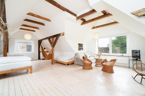 a bedroom with a bed and a living room at Ferienhaus Stranden Westfehmarn in Fehmarn