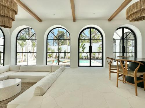 a living room with a couch and a table at Melrose x The Young Villas in Uluwatu