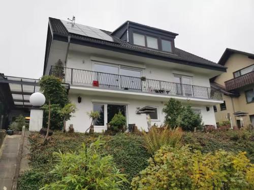a large white house with a balcony at Haus Kiel in Altenau