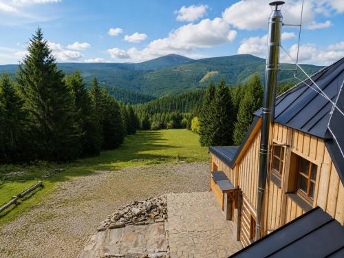 an aerial view of a house with a view of the mountains at Bouda Ticha in Dolní Malá Úpa