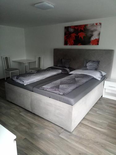 a large bed in a room with at Pohádka in Kunratice