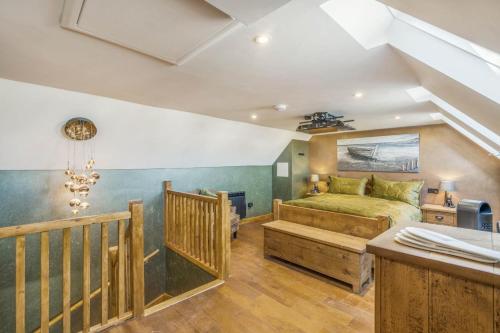 a bedroom with a large bed and a staircase at 1 Bed in Banff oc-t42474 in Banff