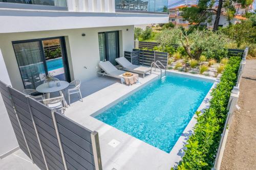 a swimming pool in the backyard of a house at Calista Horizon by Booking Kottas in Kallithea Halkidikis