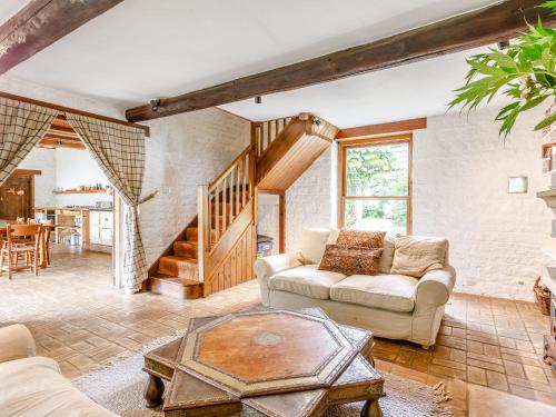 a living room with a couch and a table at The Barn - Uk51594 in Grantham