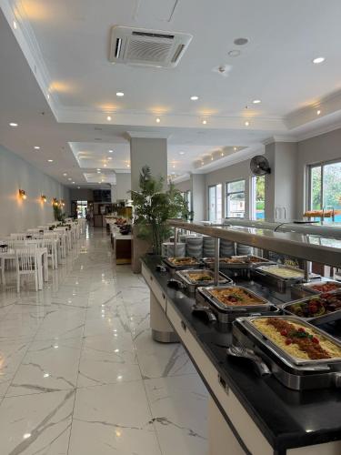 a buffet line with food on display in a restaurant at Anita Matiate Hotel in Beldibi