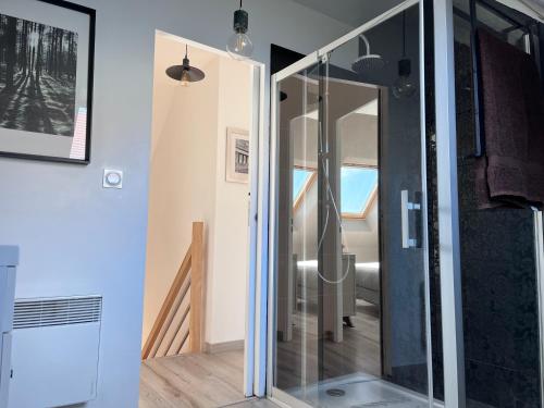 a shower in a bathroom with a glass door at Bienvenue à la maison in Étaples