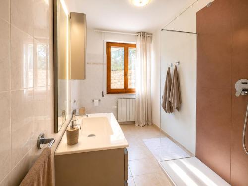 a bathroom with a sink and a shower at La Perla in Passignano sul Trasimeno