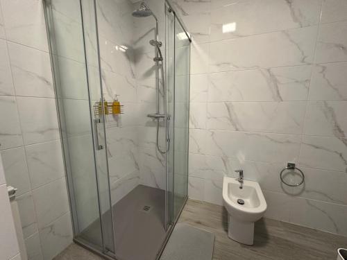 a bathroom with a shower and a toilet at Candle Home Sáenz Díez in Ourense