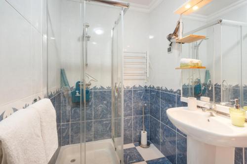a bathroom with a shower and a sink at Sunset Village in São Jorge
