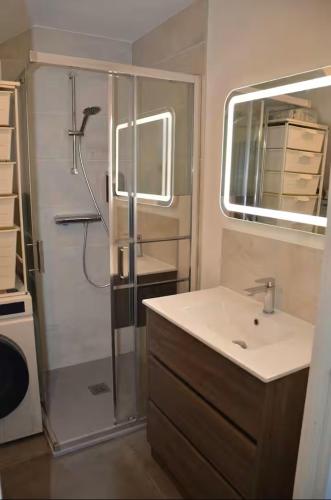 a bathroom with a shower and a sink at à la cime du mont Saint Clair in Sète