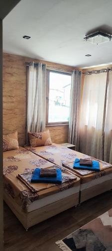 a large bed in a room with a window at Спа къща Нико in Elkhovo