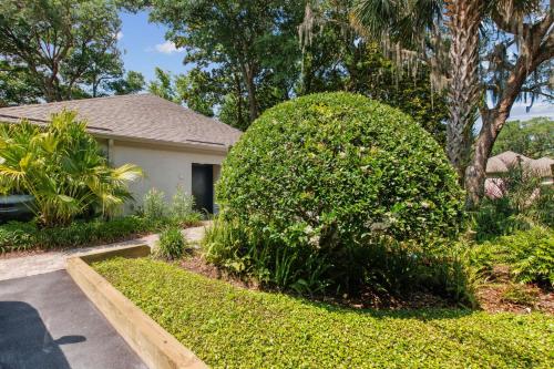 a large bush in front of a house at 1205 Lagoon Villas in Amelia Island
