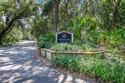 a sign for a park with plants and trees at 1205 Lagoon Villas in Amelia Island