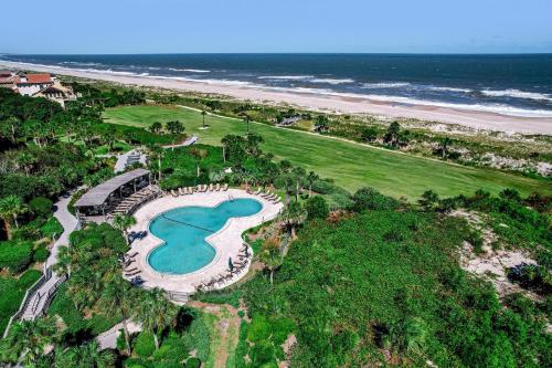 an aerial view of a golf course next to the beach at 1321 Shipwatch in Amelia Island