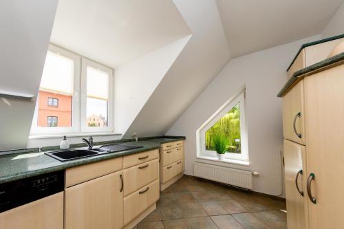 a kitchen with a sink and a window at Casa Claudio in Plau am See