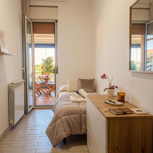 a living room with a bed and a table at Fiorucci Apartments - Veronica's House in Rome