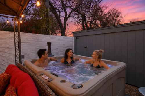 a group of people in a bath tub at West Irving Palace Miami Style in Irving
