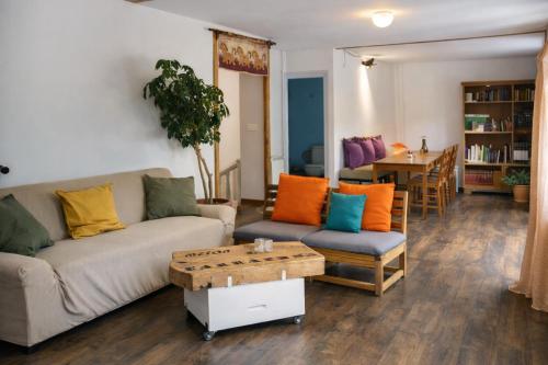 a living room with a couch and a table at Casa La Farrapona Torrestío Babia in Torrestío