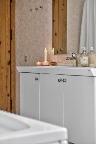 a bathroom counter with a sink and a mirror at Family Holiday Home with Jacuzzi and Fireplace in Hejls